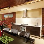 The kitchen has been seamlessly integrated into the outdoor room. Photo courtesy of Alfresco Living.