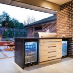 This modest outdoor kitchen serves the family’s every need. Photo courtesy of Apex Landscapes.