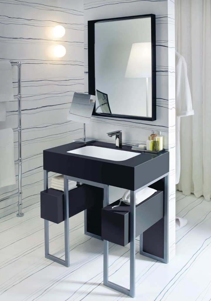 The smooth lines of a Corian Serenity basin installed within a frame of steel and Corian Deep Nocturne create a sophisticated impression. With atmospheric lighting, it becomes the statement centrepiece for a hotel suite or penthouse.