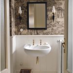 In an interior design that boasts a bold mix of vintage wallpaper, boiserie and off-white hardwood flooring, the Corian Calm washbasin in a sleek shell of Corian Glacier White harmonises perfectly with its surroundings.