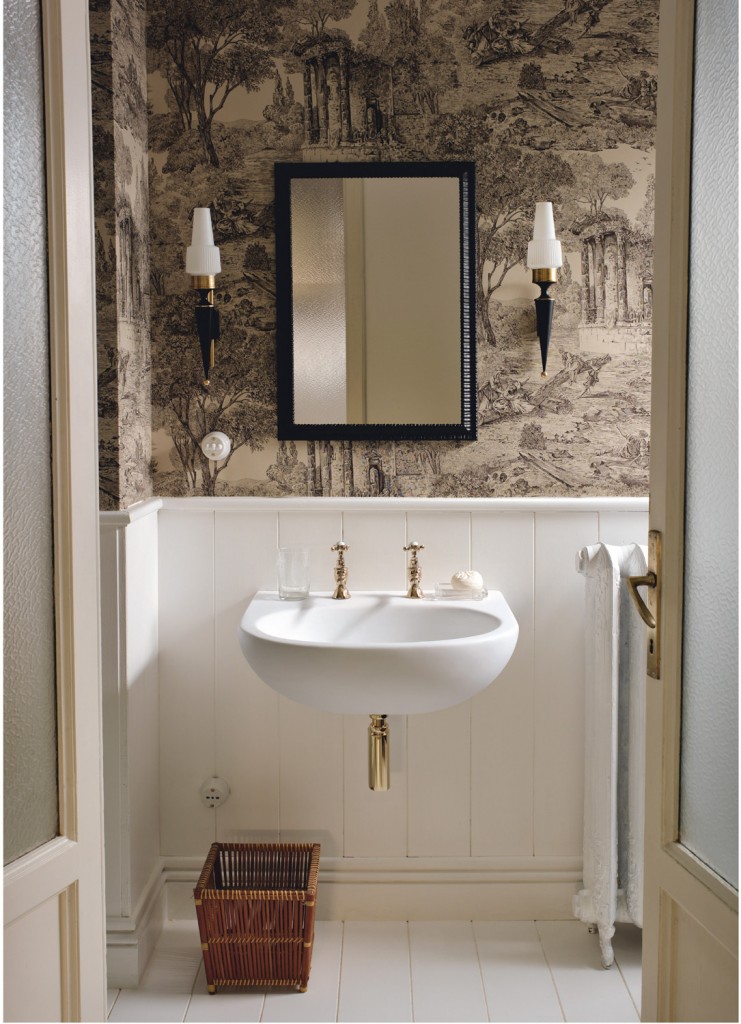 In an interior design that boasts a bold mix of vintage wallpaper, boiserie and off-white hardwood flooring, the Corian Calm washbasin in a sleek shell of Corian Glacier White harmonises perfectly with its surroundings.