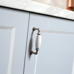 This compact kitchen design makes up for space by incorporating cupboards and drawers within a U-shaped bench