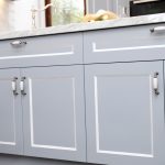 This compact kitchen design makes up for space by incorporating cupboards and drawers within a U-shaped bench