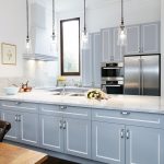 This compact kitchen design makes up for space by incorporating cupboards and drawers within a U-shaped bench