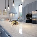 This compact kitchen design makes up for space by incorporating cupboards and drawers within a U-shaped bench