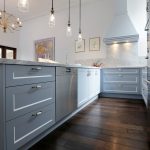 This compact kitchen design makes up for space by incorporating cupboards and drawers within a U-shaped bench