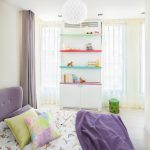Bright colours balance with white walls and soft drapes