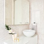 A textured vanity brings interest to the calming bathroom