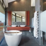 A freestanding tub by the window is made for relaxation