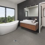 A freestanding tub by the window is a serene spot for relaxation