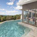 A wraparound pool offers a place to cool off during hot summer days
