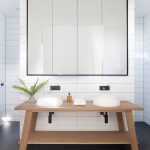 Large-format tiles make the bathroom appear more spacious