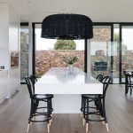 ED’S FAVE A thick stone slab in the kitchen brings a luxe element into the minimalist interior