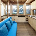 The custom-made lounge easily flips over into a dining table with stools