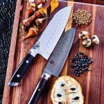 Shun Kaji double hollow-ground sumo santoku 7.5-inch knife, Shun Hiro santoku 7-inch knife and walnut-edge grain carving board
