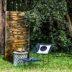Athos chair and stool, Black  Circle cushion, Bambileke  stool/side table and decorative metal screen. yardware.com.au Large Resin Earth bowl in Dark Horn, Resin Boulder salt grinder in Moody Blue, Resin Cloud dish and side plate in Seaweed Malachite, Cloud bowl in brass and Resin Modern Tribal platter in Emerald Swirl. dinosaurdesigns.com.au