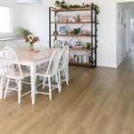 This contemporary coastal cottage uses AquaLife flooring