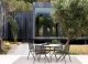 An intimate outdoor dining set-up, featuring the Branch 125 round table by Tribu. 