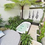 View of spa shower and garden plants