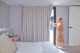 Lady opening curtains