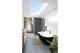 Elinea gloss black and white freestanding bath. Also available in all white gloss