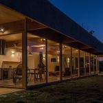 The house is arranged on the sloping site as two joined rectangular boxes