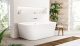 Image of a spa bath in a bathroom decorated with plants, a window and a rug