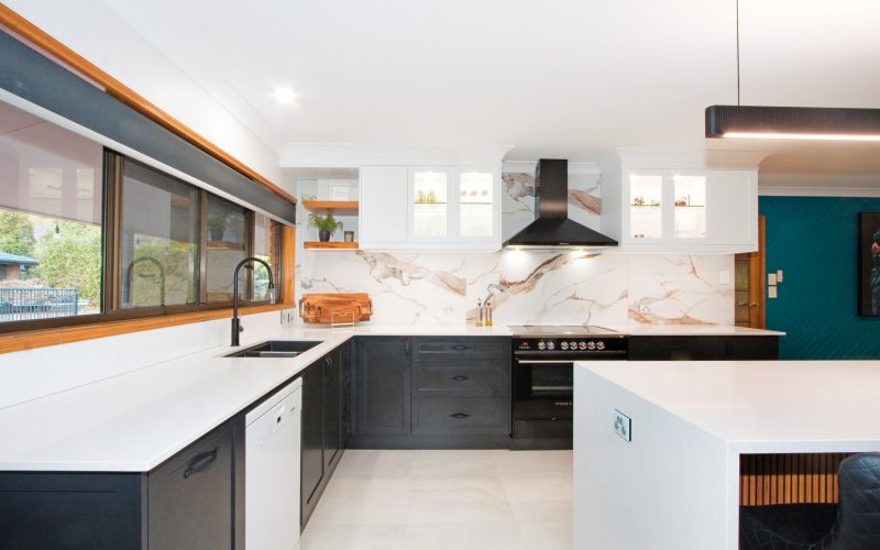 A black shaker style kitchen adds a touch of contemporary country