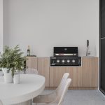 Wide shot of an outdoor kitchen with a 4-gas burner unit