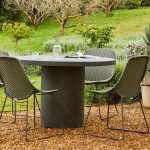 The Petra round dining table and Corsica scoop dining chairs