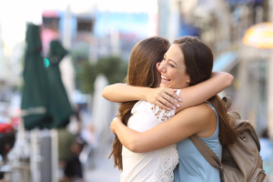 Two trusting friends hugging