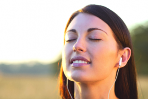 woman headphones listen sound phone technology bliss meditate