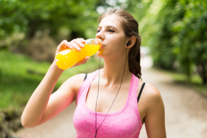 42246229 – young woman drinking after sport