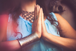 close up of woman hands in namaste gesture outdoor shot mudra yoga spirit