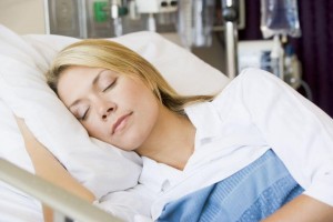 Woman asleep In hospital bed