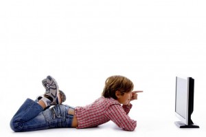 side pose of boy watching screen on an isolated white background