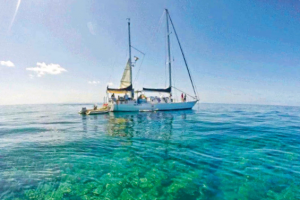 coral reef boat fish blue ocean sea