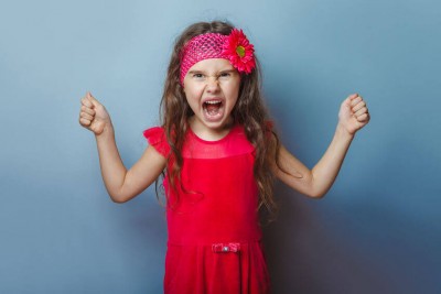 young girl child screaming with anger