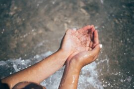 dehydration and why water is important hands catching water
